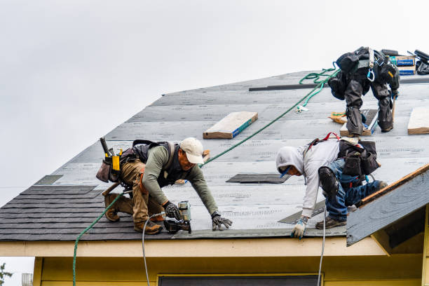 Professional Roofing technician working in East Rockaway, NY